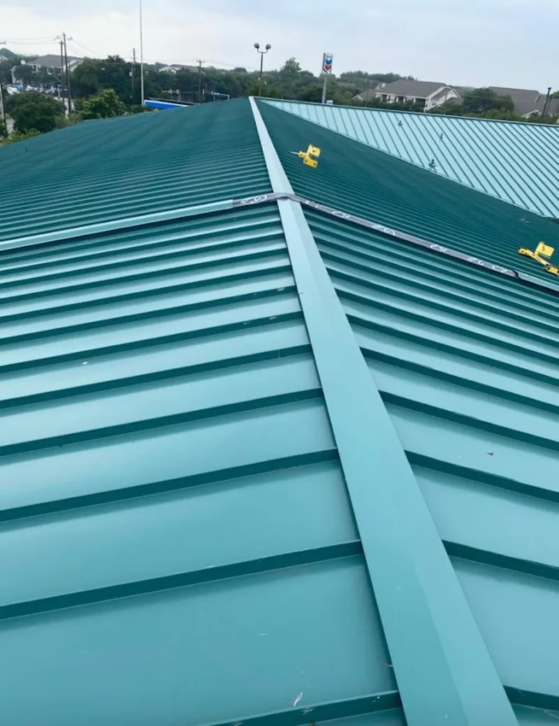 Green commercial metal roof ridge and valley for Metal Roof Repair in Williamsburg